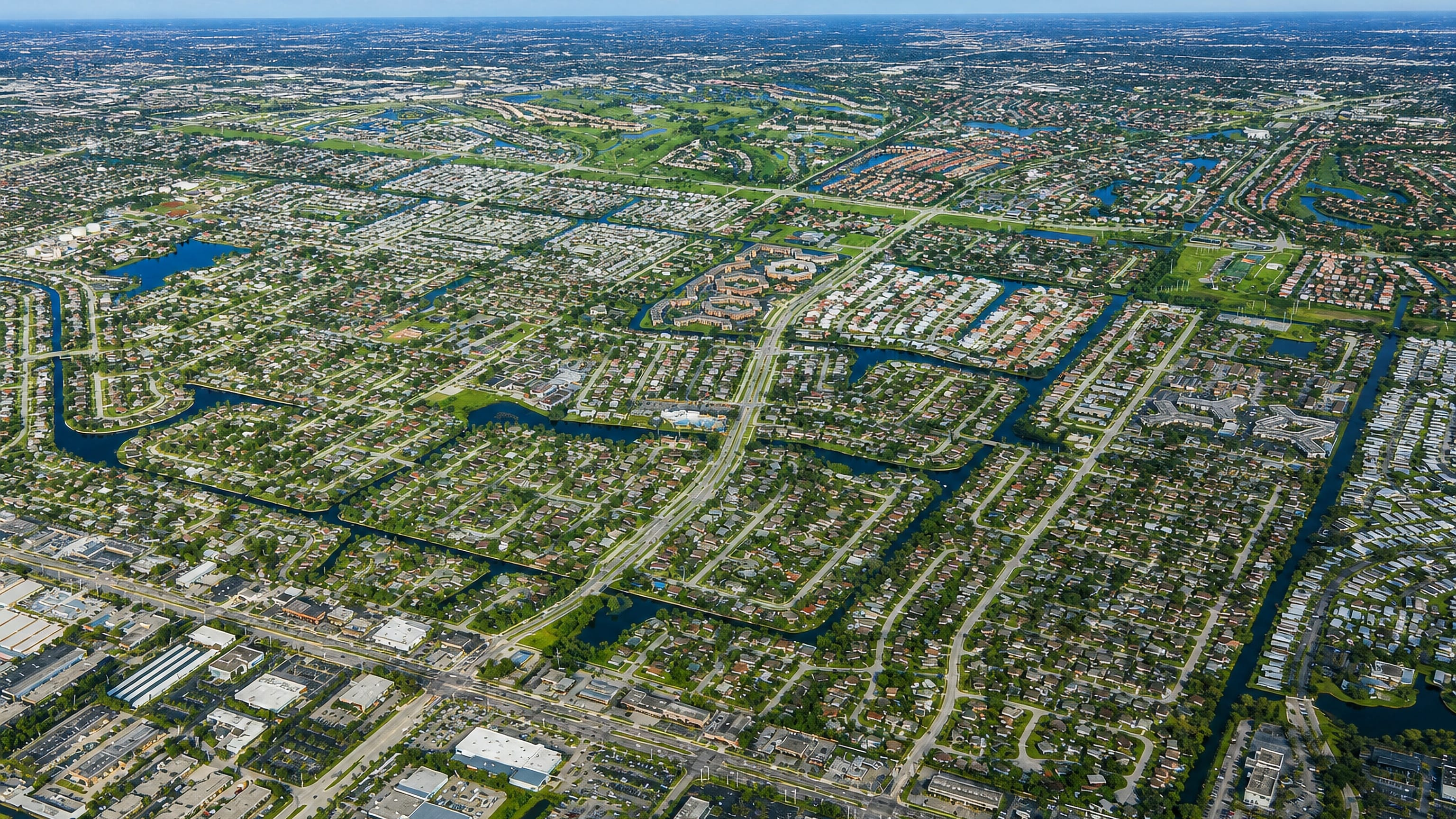 High aerial view of Margate, Florida, its canal-laced suburban grid stretching to the horizon.