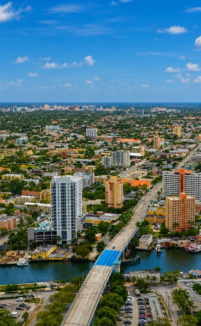 Aerial view of Little Havana in Miami along the Miami River, with mid-rise towers and the ballpark