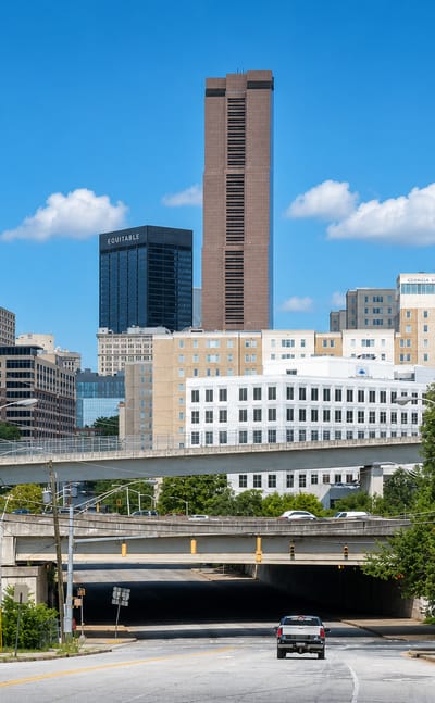 Downtown Atlanta skyline with towers around Peachtree Center rising above a highway underpass