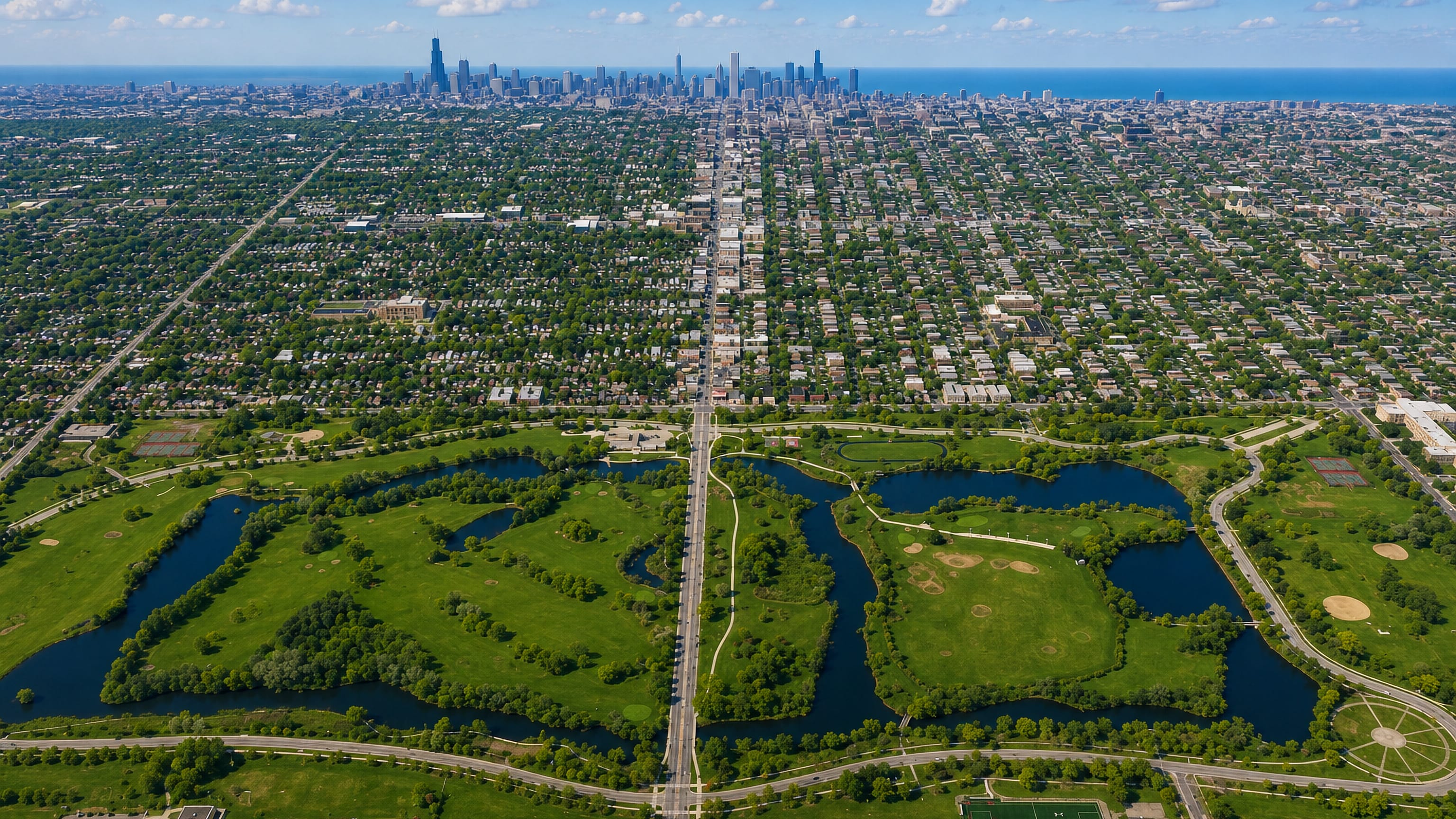 Marquette Park's lagoons in Chicago Lawn with the boulevard running north to the downtown Chicago skyline