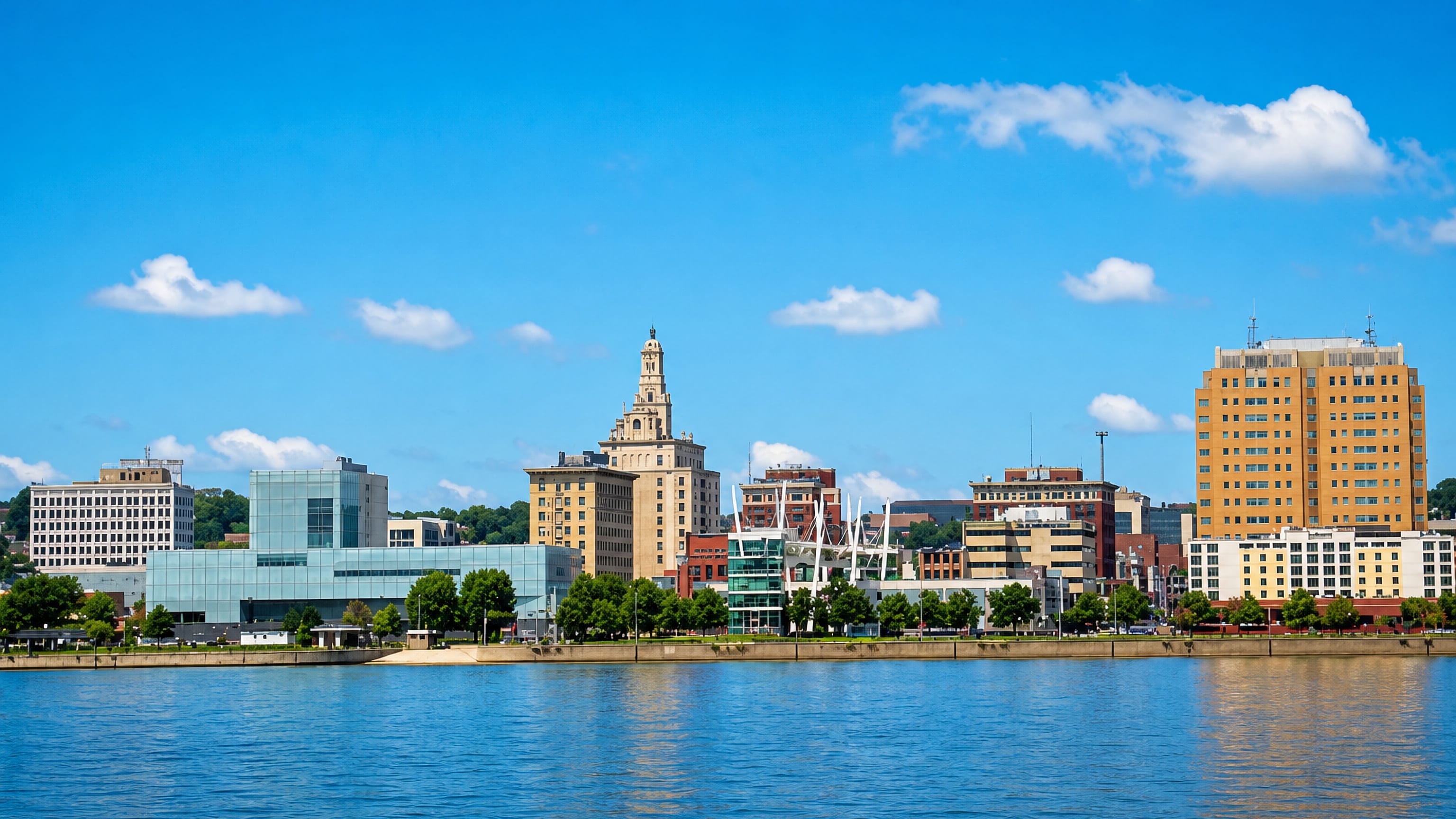 Davenport's downtown skyline across the Mississippi River, with its glass art museum and spired tower