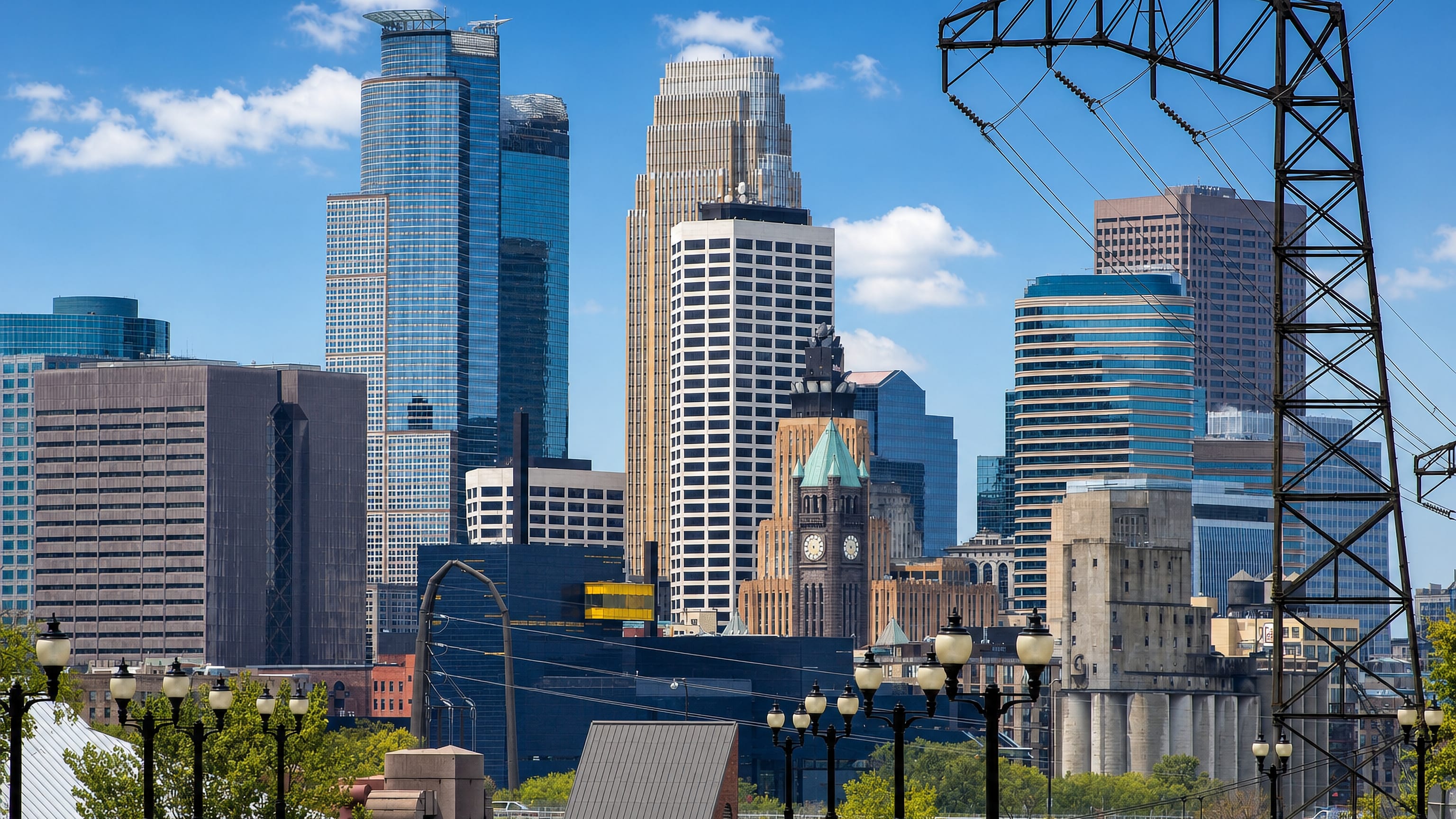 Downtown Minneapolis skyline with City Hall's clock tower and riverfront mills seen from near Dinkytown