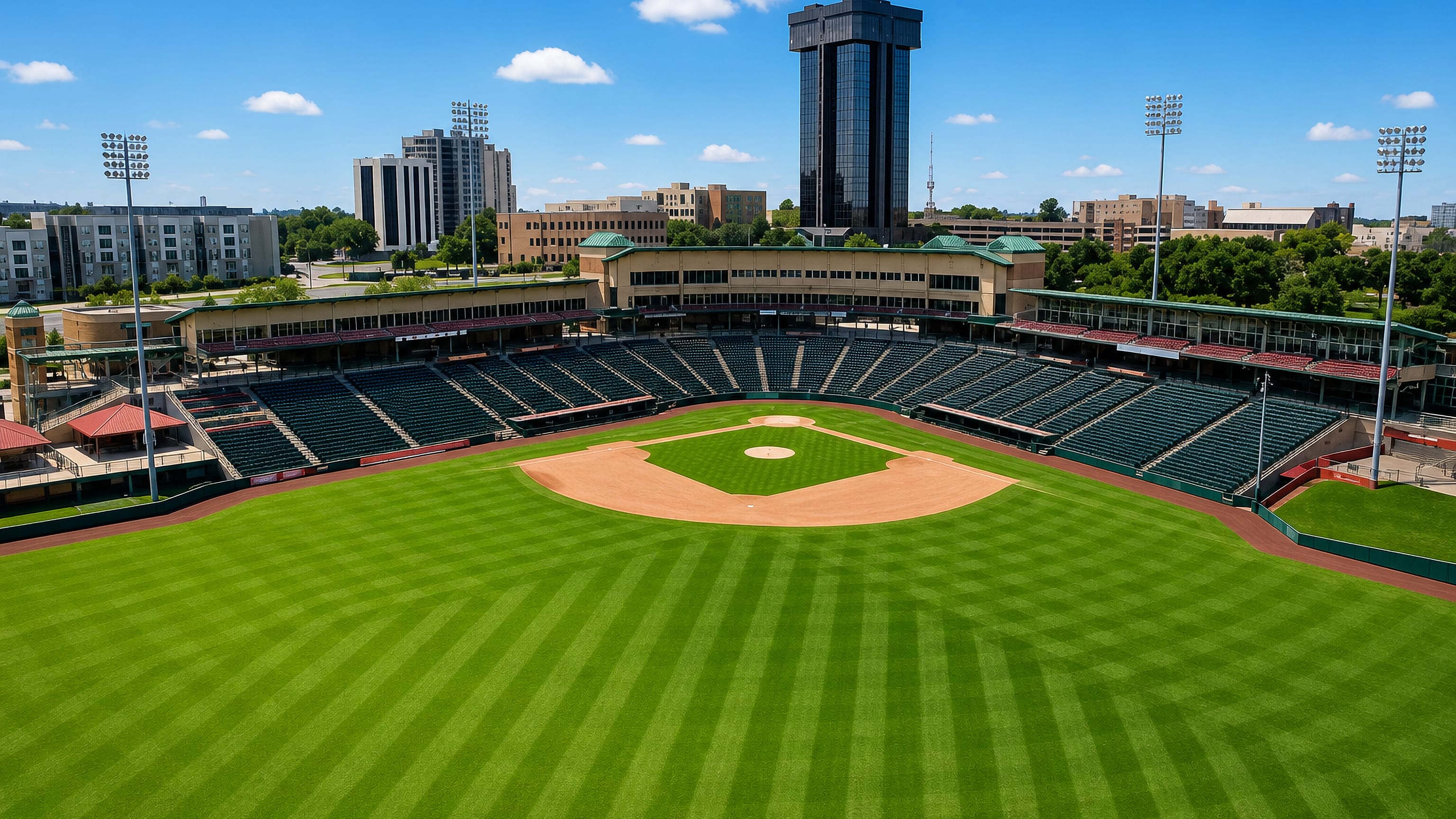 Springfield, Missouri's downtown ballpark with the dark Hammons Tower rising over the outfield skyline