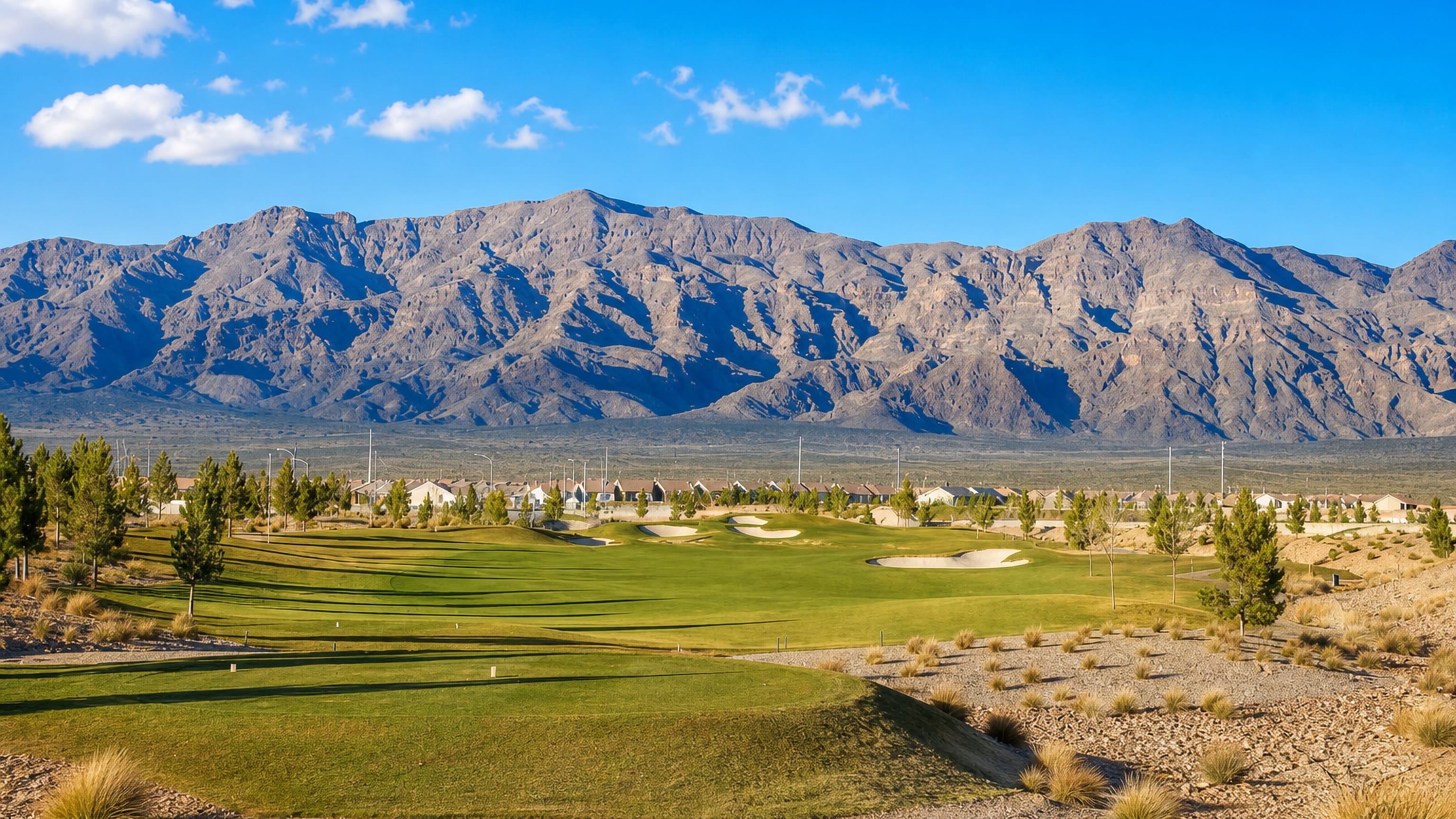 Golf course fairways and desert homes below the Sheep Range mountains in North Las Vegas