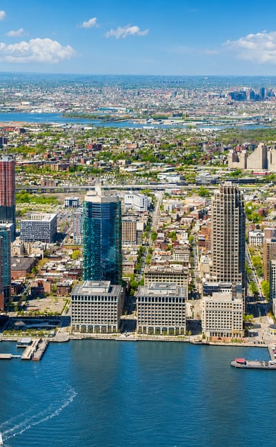 Jersey City, New Jersey waterfront skyline on the Hudson River, led by its tallest tower and a marina.