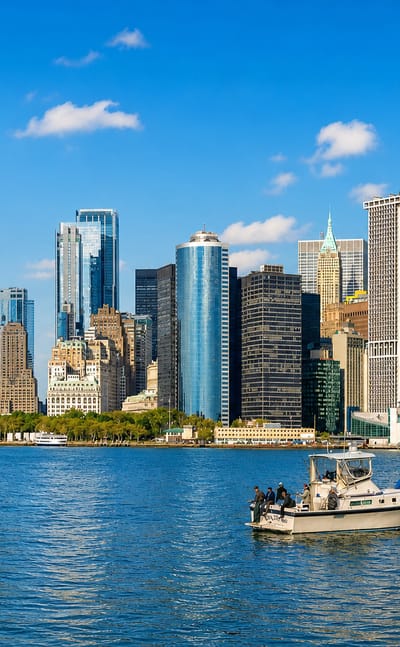 Lower Manhattan's skyline and One World Trade Center seen across the harbor from the Staten Island Ferry.