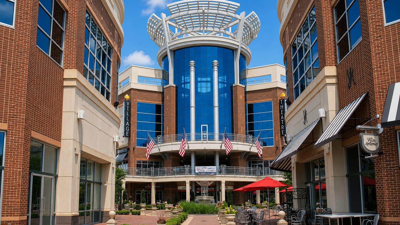Upscale brick-and-glass mixed-use village center in Ballantyne, Charlotte, with US flags and outdoor cafe seating