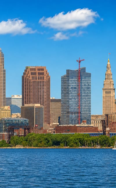 The downtown Cleveland, Ohio skyline with Key Tower and Terminal Tower rising above the Lake Erie shoreline.