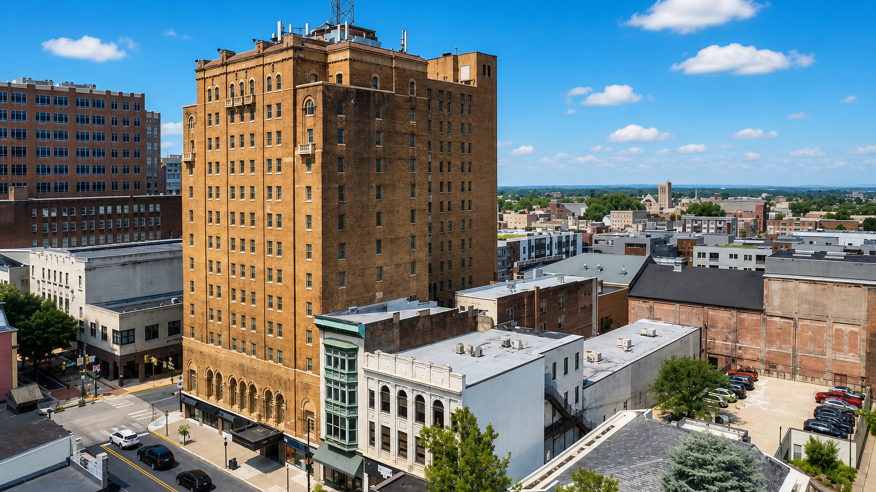 Downtown Allentown, Pennsylvania, with a 1920s brick tower above low-rise storefronts and a copper bay window.