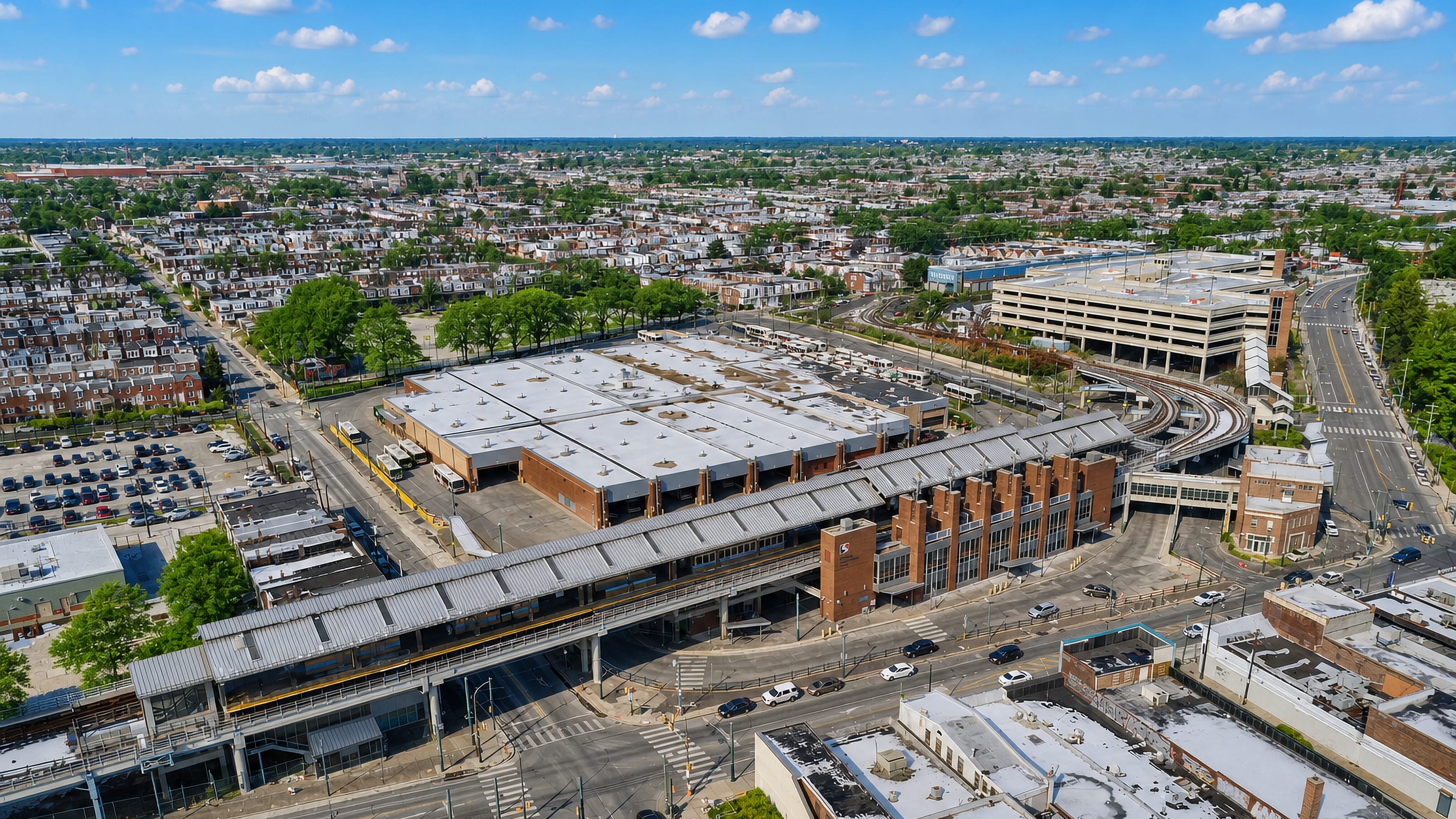 Aerial view of Frankford in Philadelphia, with the elevated Frankford Transportation Center and rowhouse streets below.