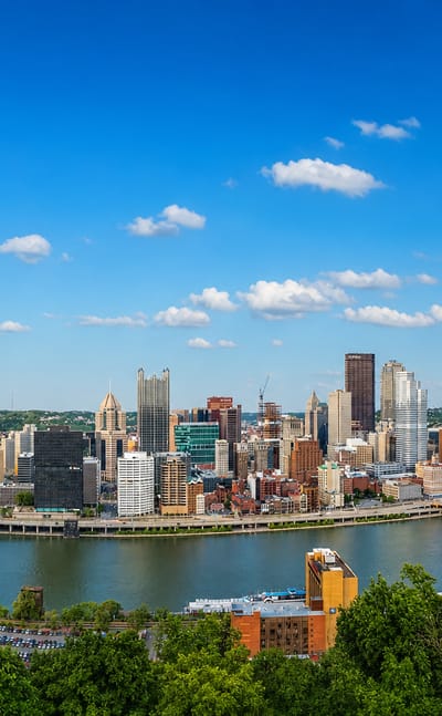 Pittsburgh's Golden Triangle skyline and three rivers viewed from Mount Washington, with the yellow bridges.