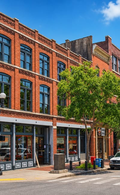 Historic Victorian red-brick commercial buildings line 2nd Avenue North in Nashville's Second Avenue District.