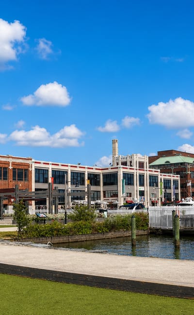 Alexandria, Virginia, Old Town waterfront with brick buildings, a marina and boats along the Potomac River.