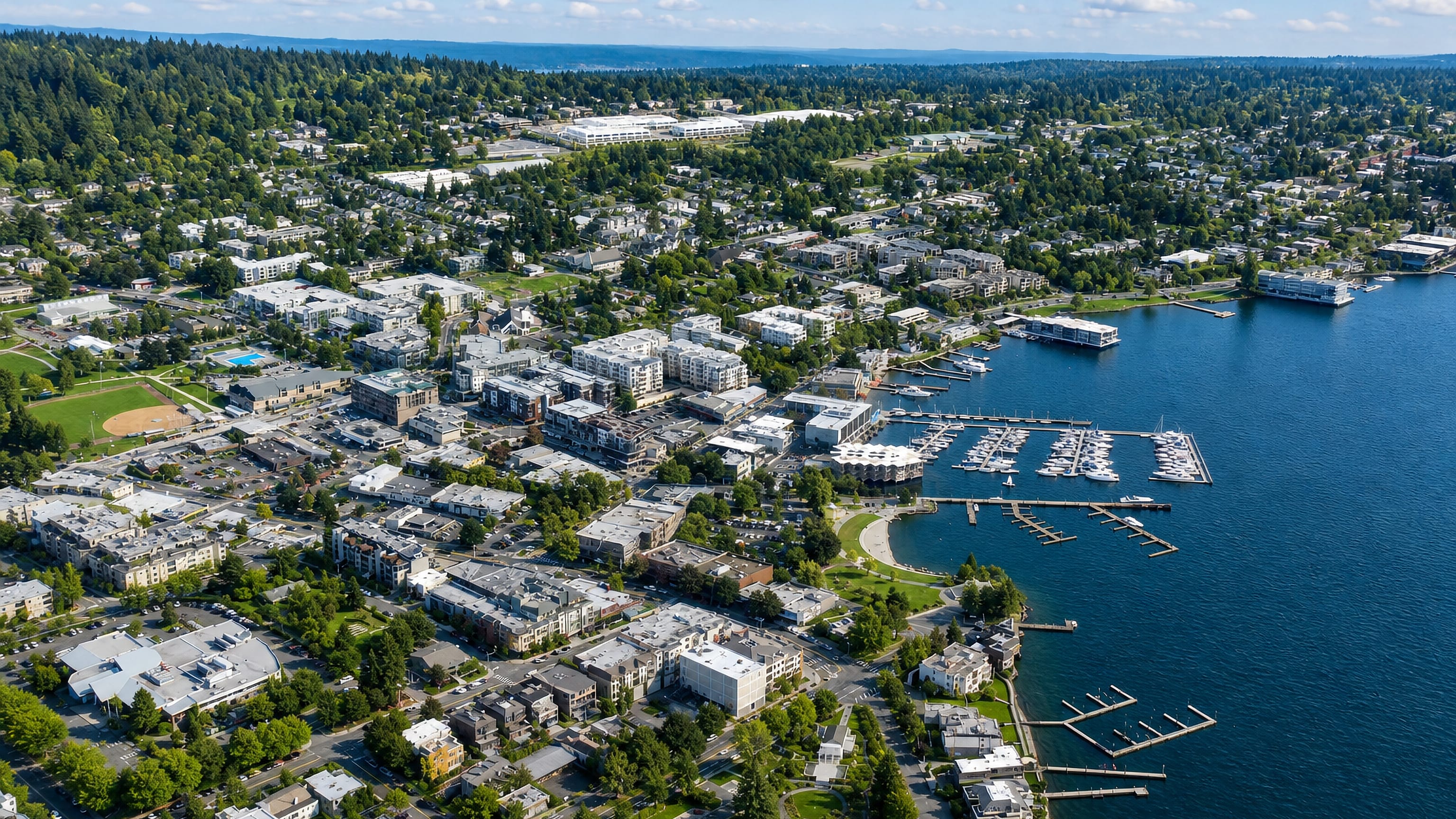 Aerial view of downtown Kirkland, Washington, with its marina docks and waterfront parks on Lake Washington