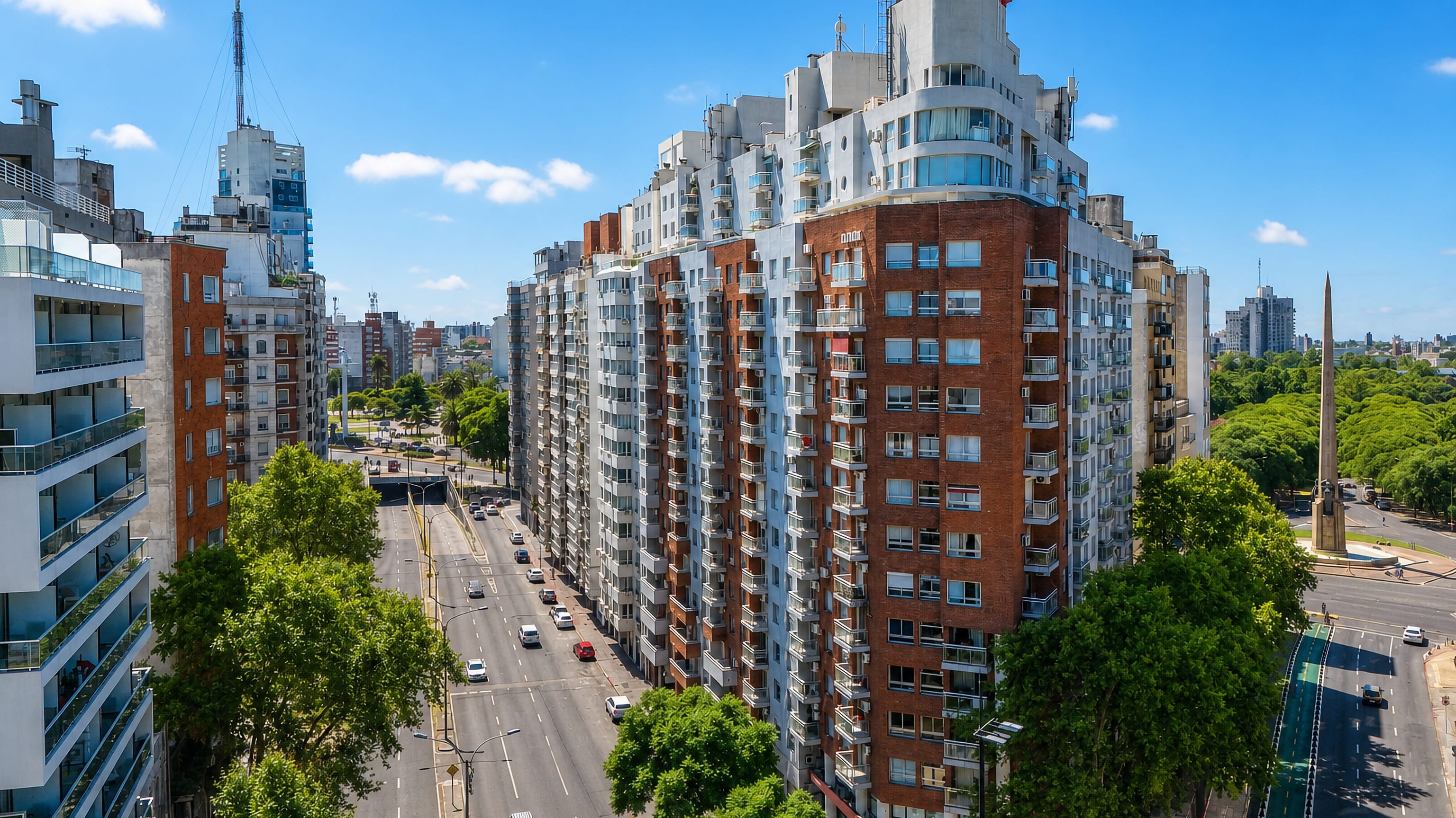 Tres Cruces in Montevideo: apartment towers along Bulevar Artigas beside the Obelisco monument.