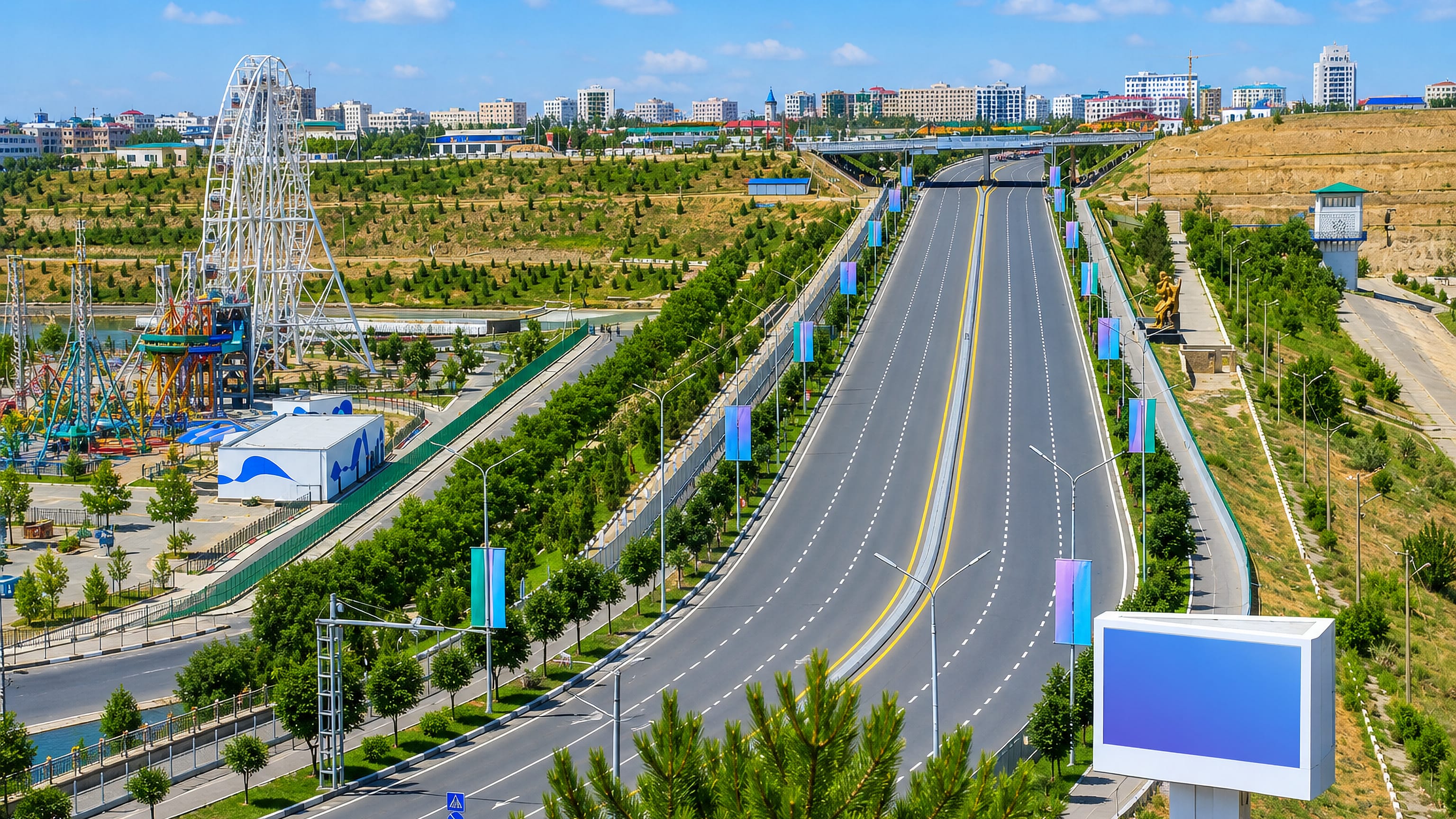 Wide tree-lined boulevard through Namangan, Uzbekistan, with a riverside funfair Ferris wheel and white apartment blocks