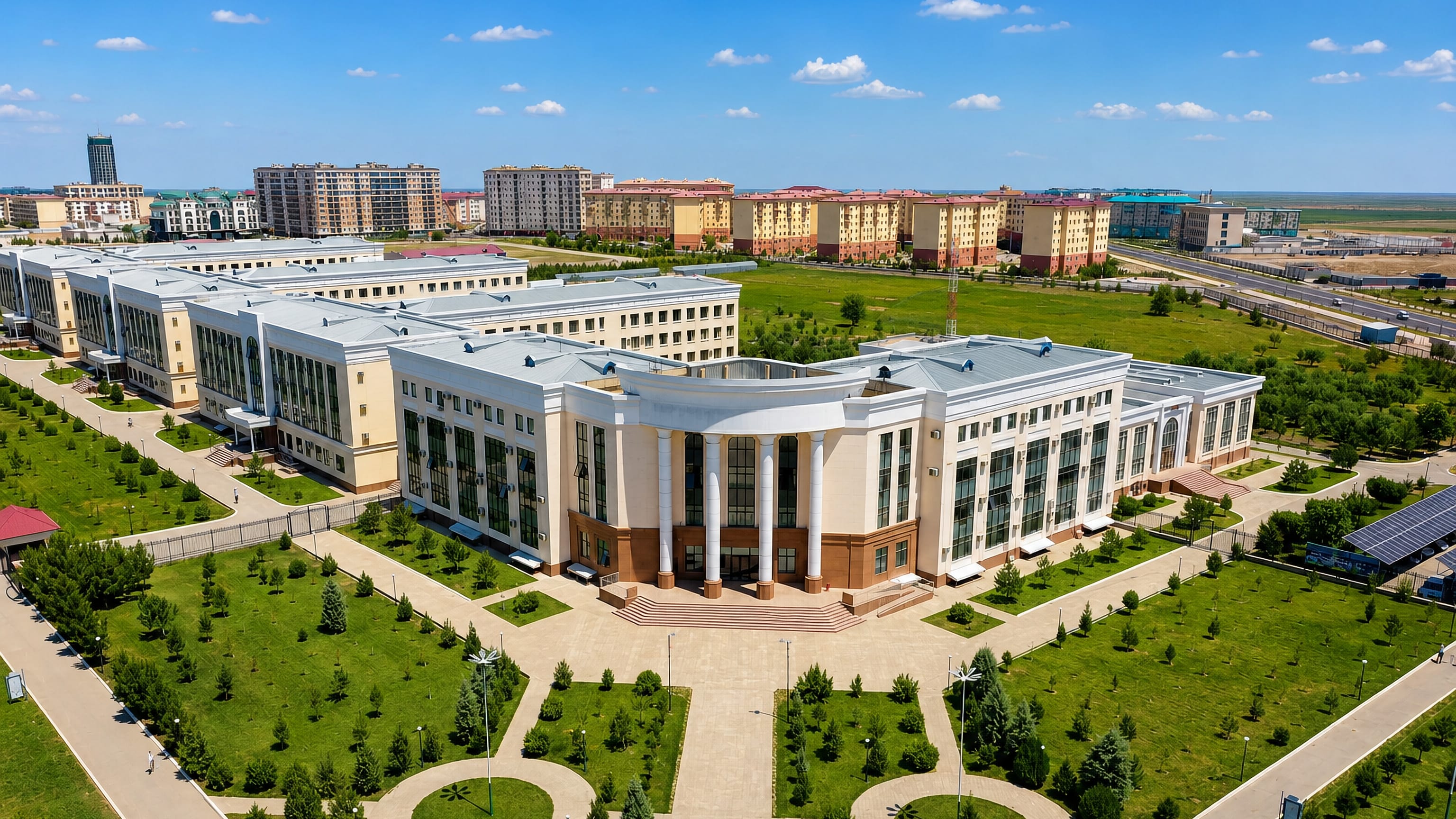 Aerial view of a columned institute building and apartment blocks in the planned city of Navoiy, Uzbekistan.