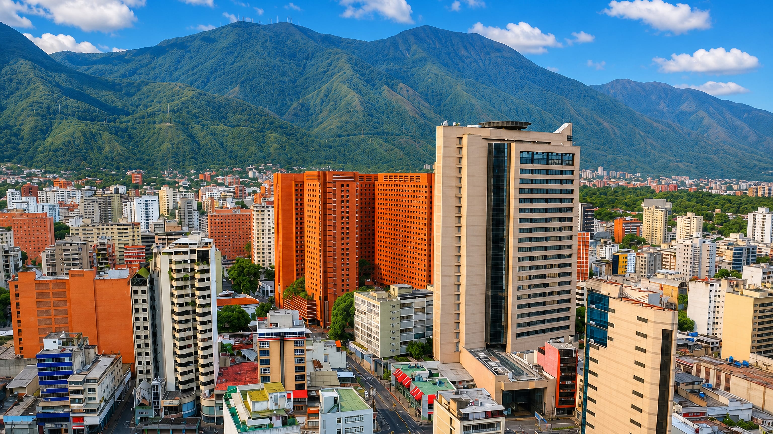 High-rise towers of Sabana Grande, Caracas, backed by the green ridge of the Ávila mountain.