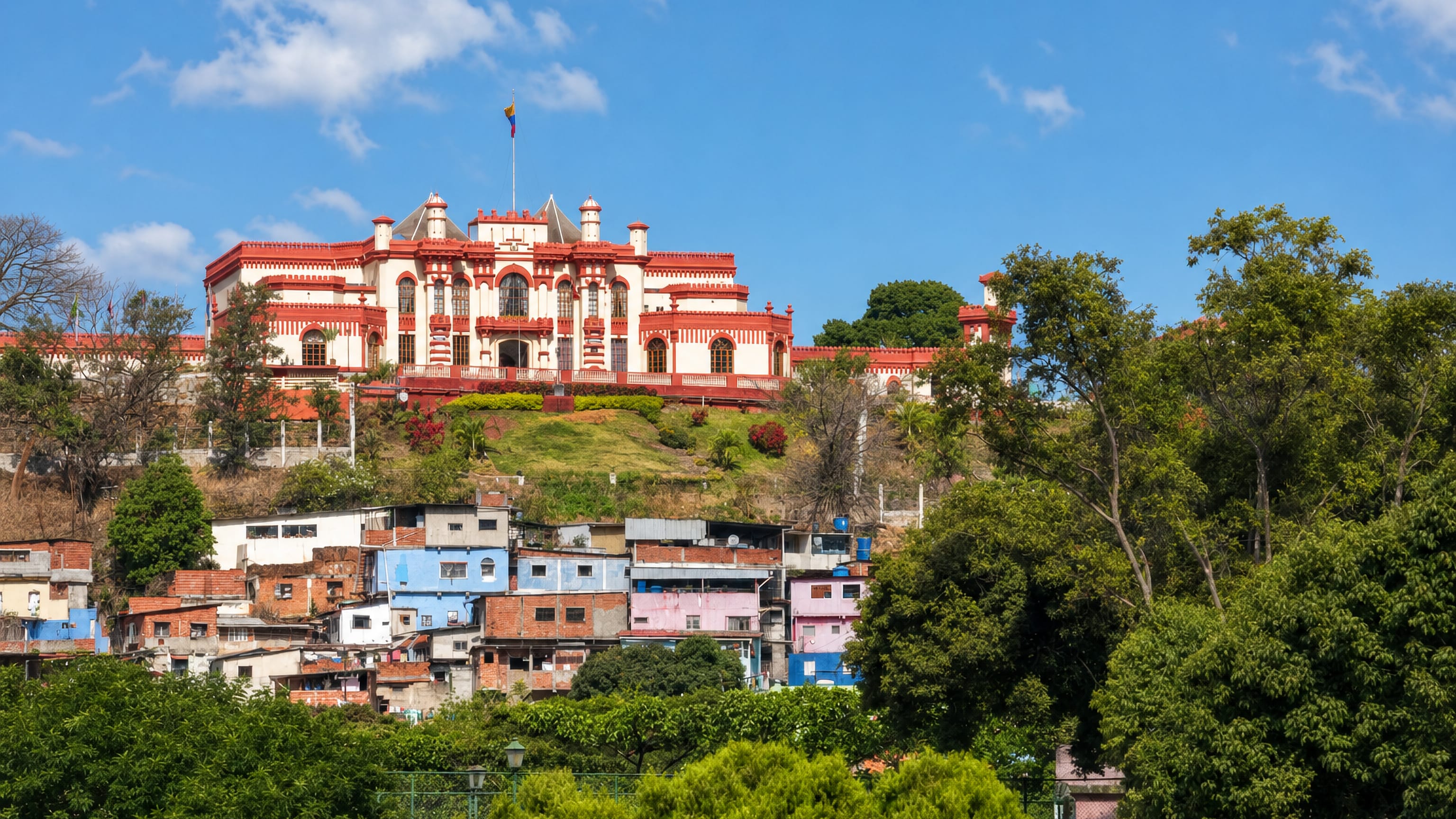 A red-and-white hilltop fortress-museum above the colourful barrio houses of Veintitrés de Enero, Caracas.