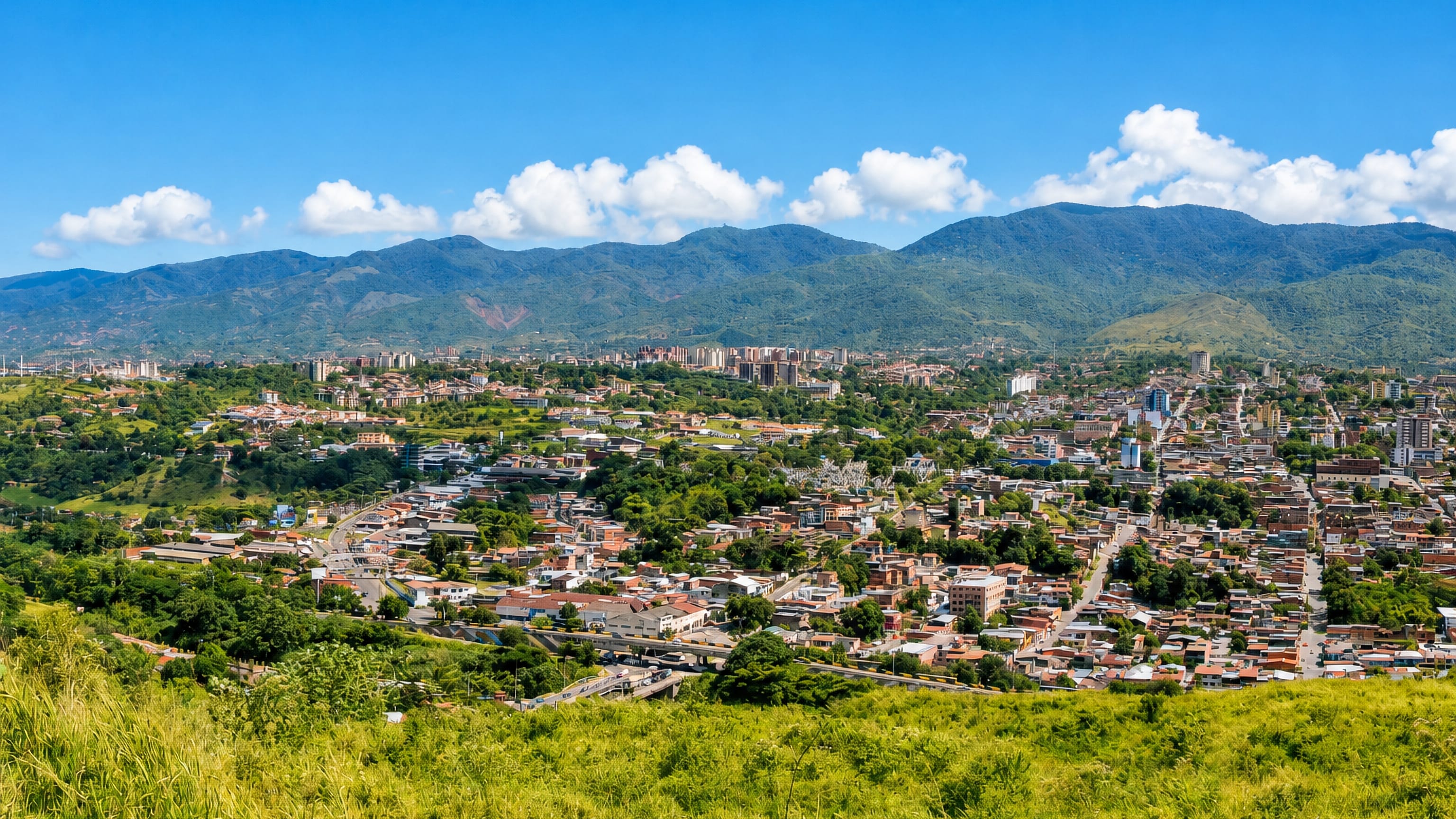San Cristobal, Venezuela, spread across an Andean valley with green mountain ridges rising behind.