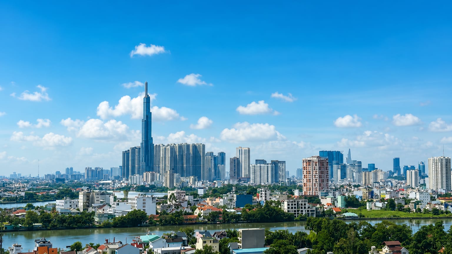Ho Chi Minh City skyline with the towering Landmark 81 spire and the Bitexco tower rising over the Saigon River