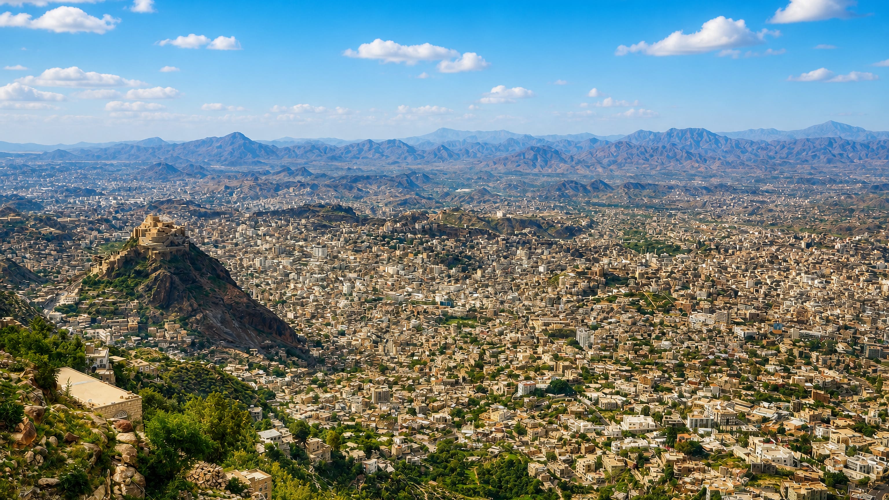 Aerial view of Taiz, Yemen, with Cairo Castle on its rocky spur and mountains beyond
