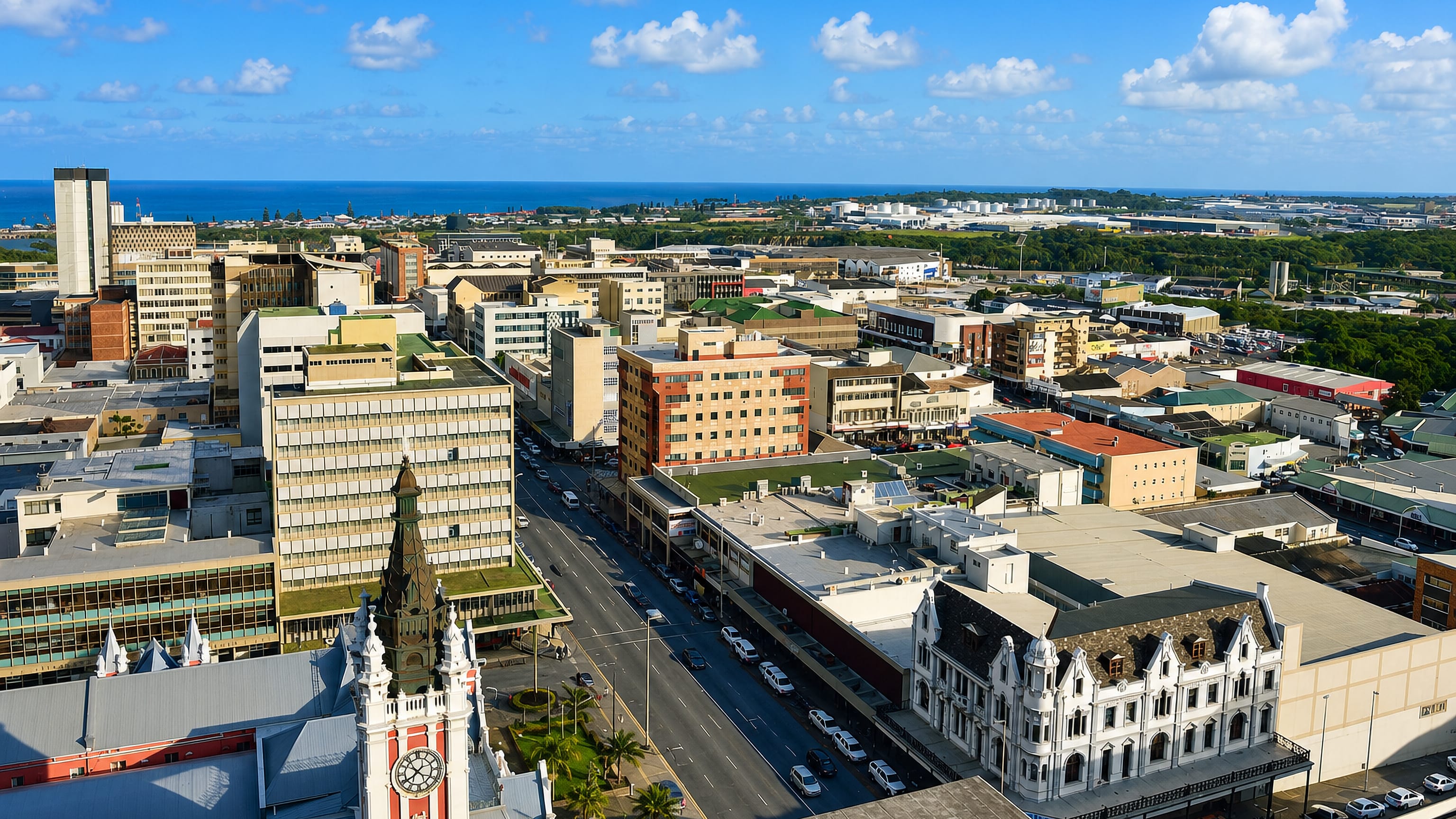 Aerial view of East London's city centre in South Africa, its clock tower and main street running down to the ocean.