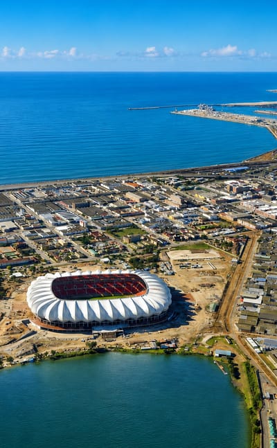Aerial view of Gqeberha with the Nelson Mandela Bay Stadium, North End Lake and the Indian Ocean coastline