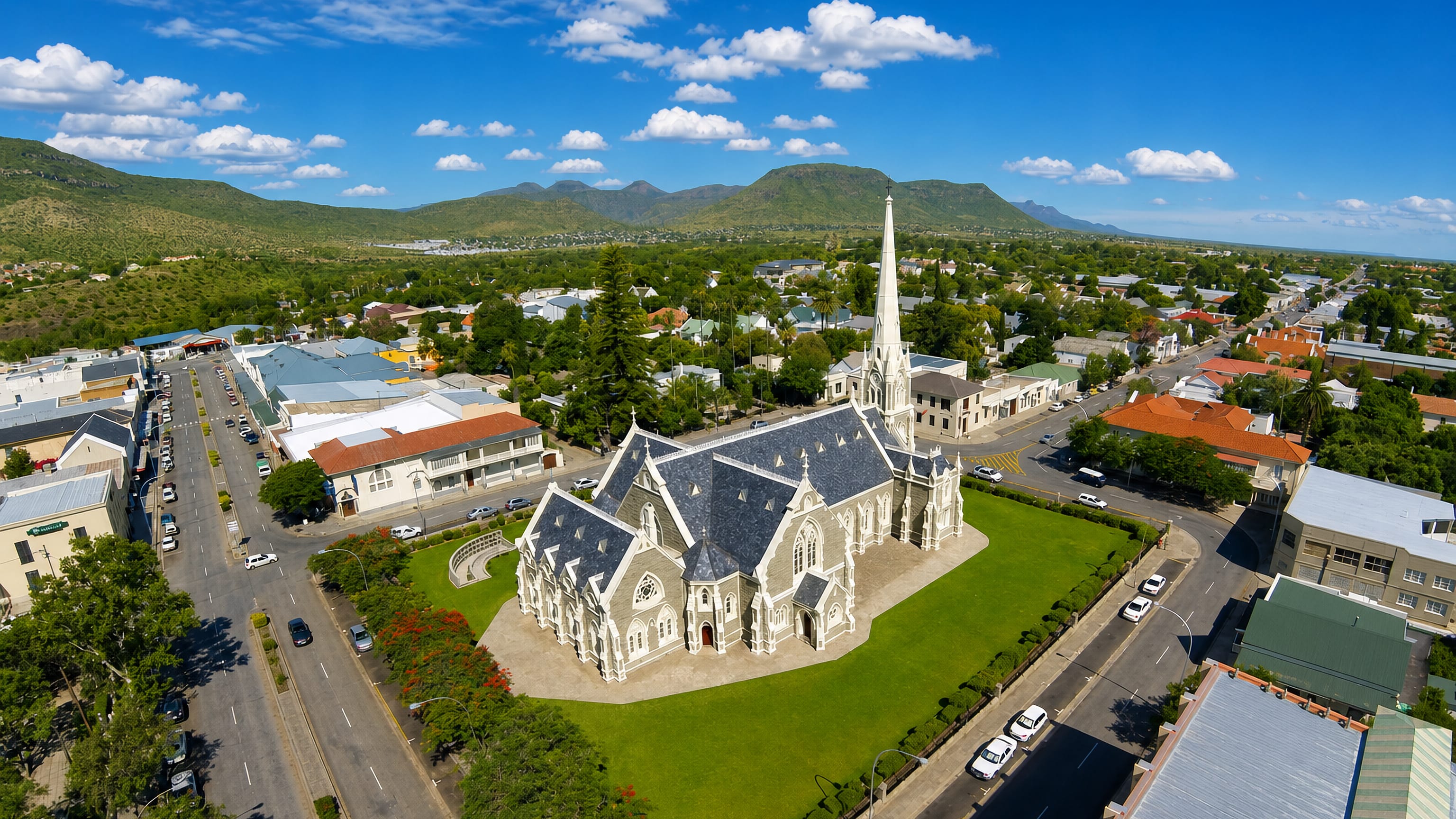 Graaff-Reinet's Dutch Reformed Grootkerk and Victorian streets below the Karoo hills.
