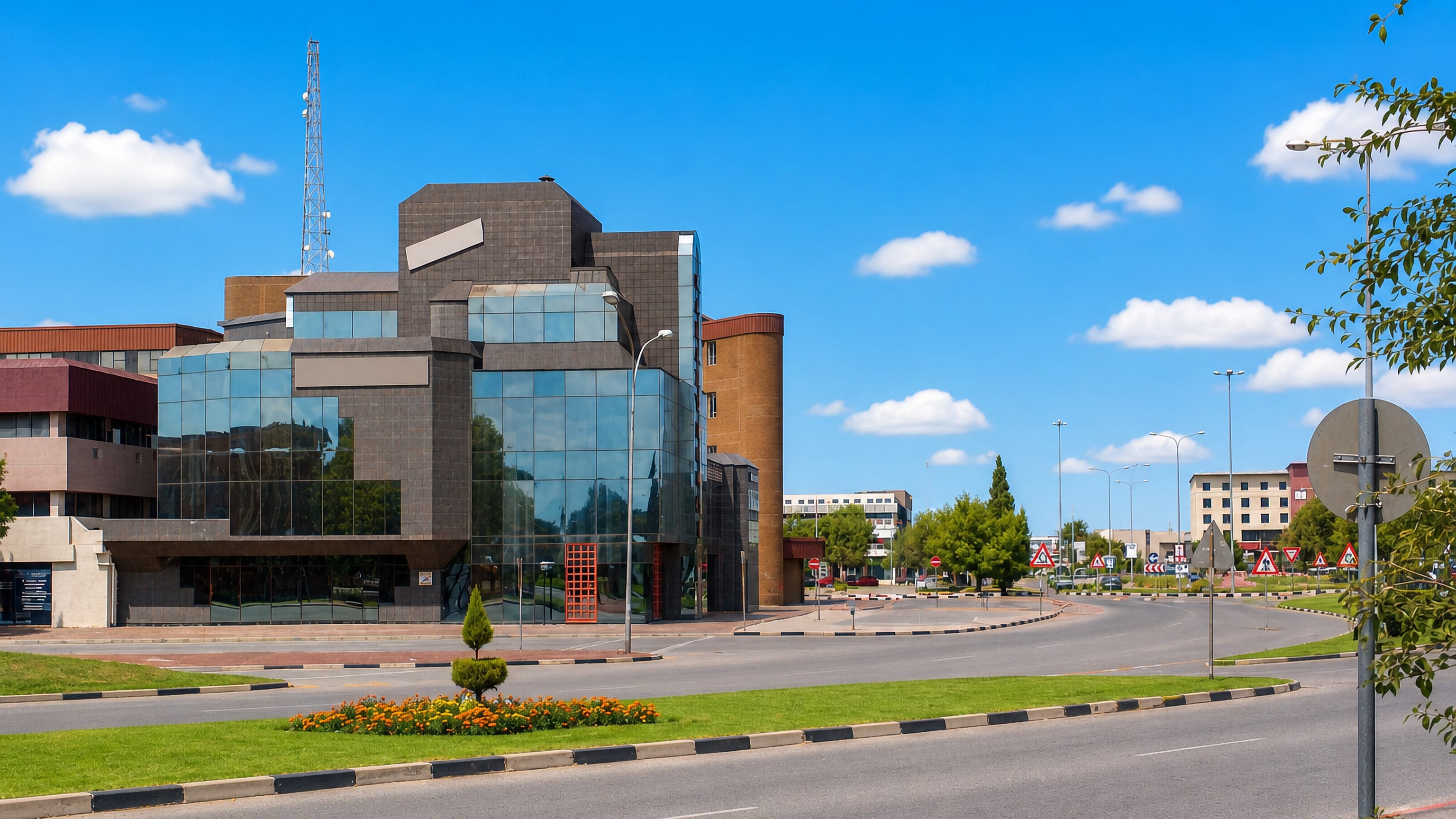 Glass-fronted office block on a wide roundabout street in Welkom, Free State