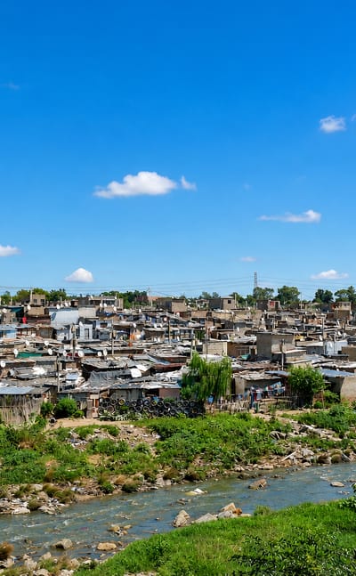 Densely packed shacks and brick houses of Alexandra, Johannesburg, above the Jukskei River.