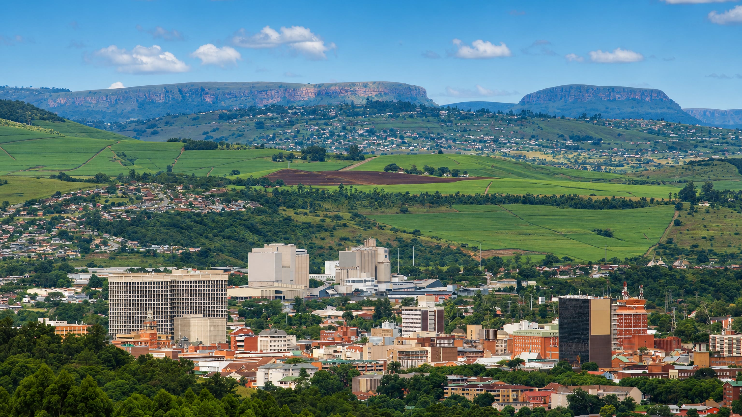 Pietermaritzburg's low-rise CBD in its green KwaZulu-Natal valley, backed by flat-topped escarpment hills.