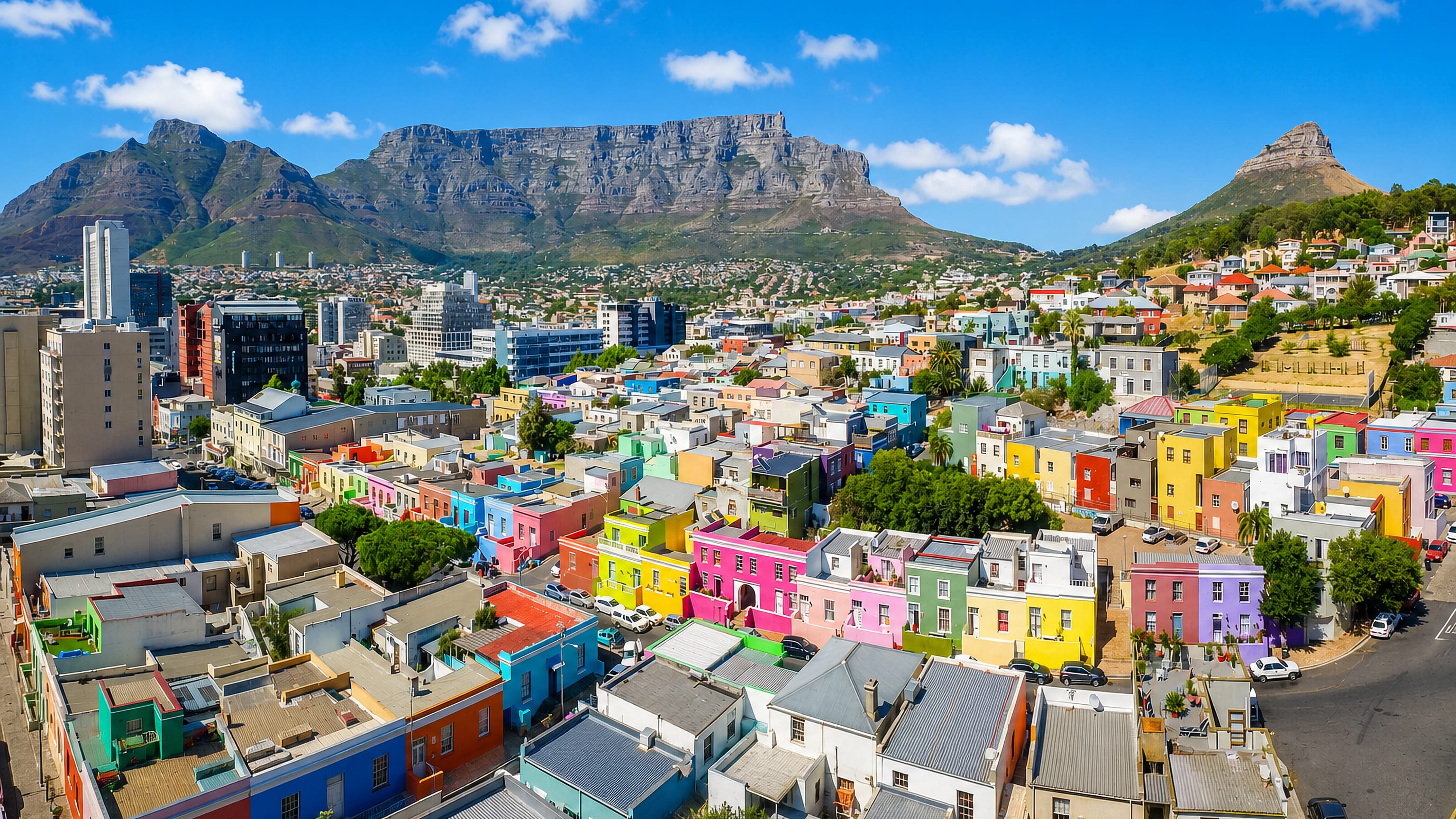 Brightly painted houses of Bo-Kaap below Table Mountain, Devil's Peak and Lion's Head in Cape Town.