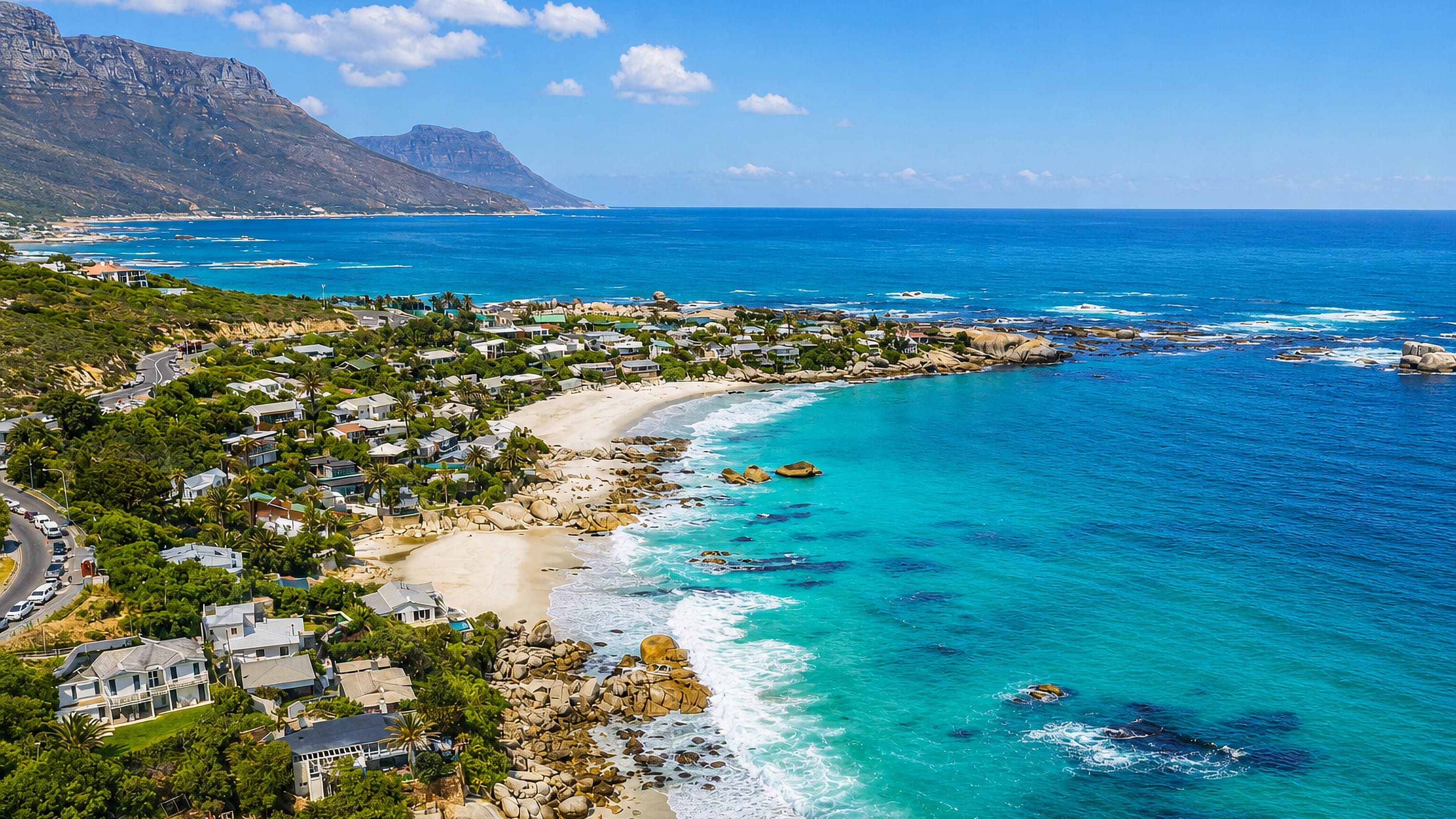 Turquoise coves, granite boulders and hillside villas at Clifton below Cape Town's Twelve Apostles.