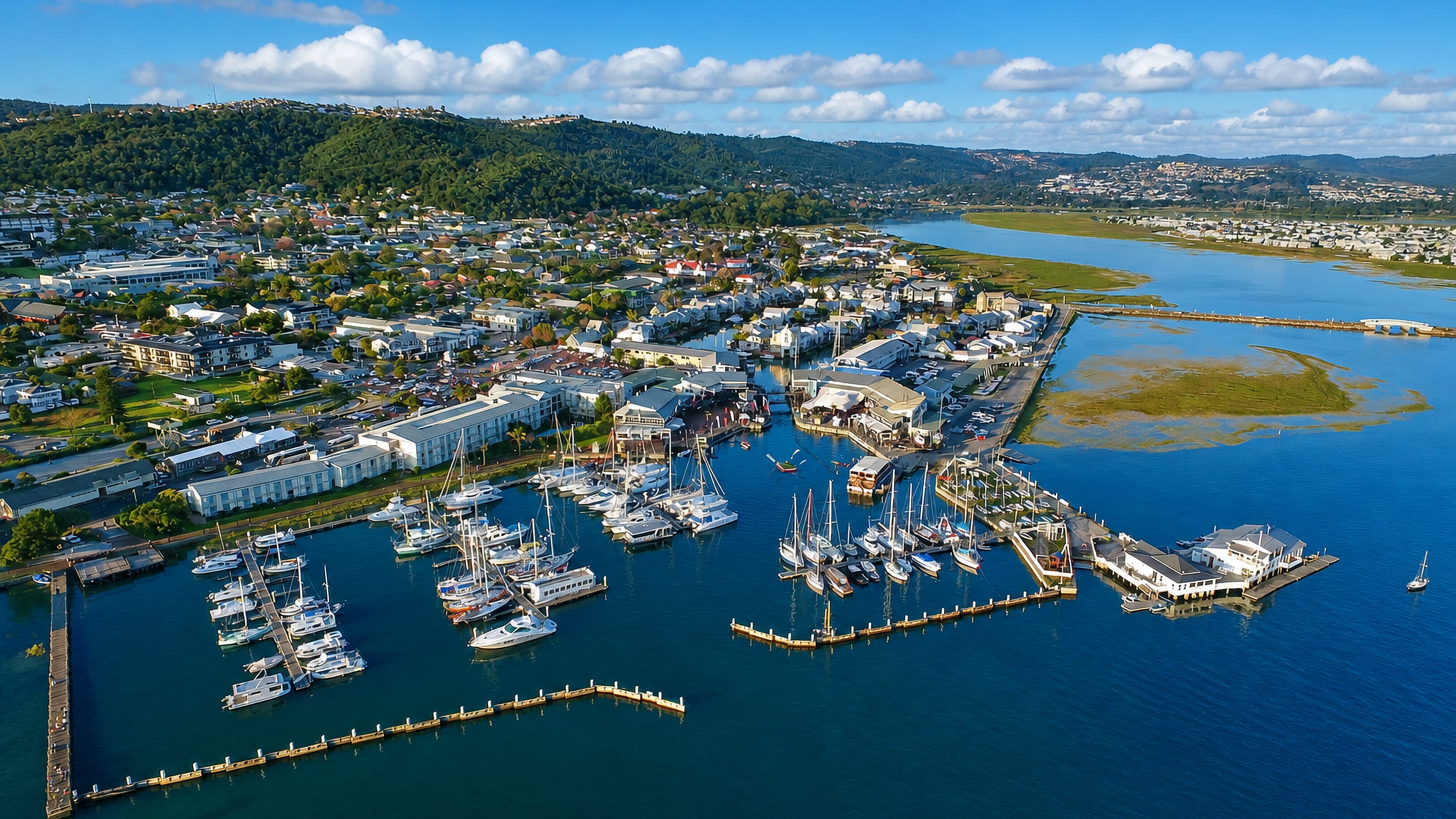 Knysna's marina and waterfront on the lagoon, with the forested Knysna hills rising behind the town.